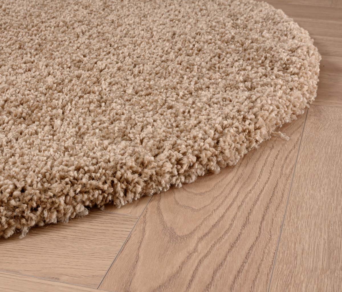 Round thick rug - Shaggy Grand beige - close up zijkant Round thick rug - Shaggy Grand beige - close up zijkant
