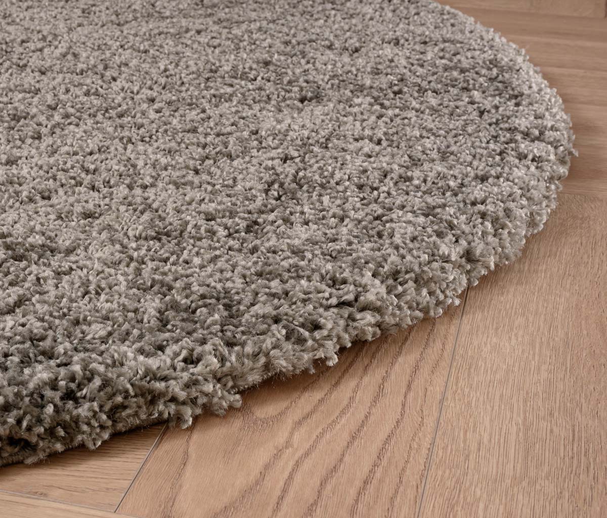 Round thick rug - Shaggy Grand light grey - close up zijkant Round thick rug - Shaggy Grand light grey - close up zijkant