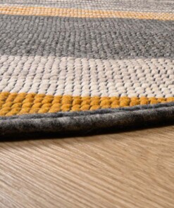 Round wool rug - Lett ochre yellow/grey - close up, thumbnail