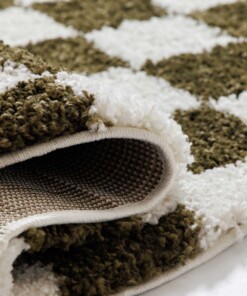 Round checkerboard rug - Check ivory/olive green - close up, thumbnail